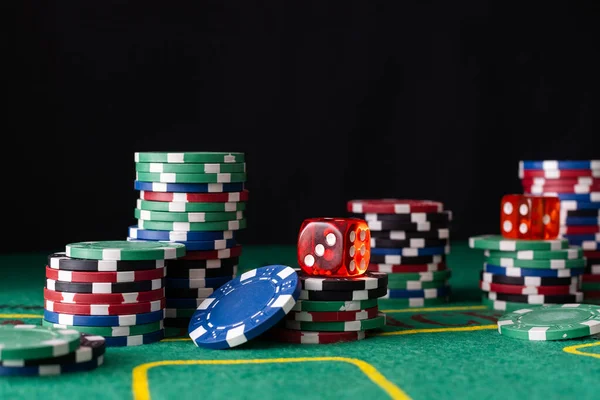 cards, dice and poker chips, isolated on black composition. High quality photo
