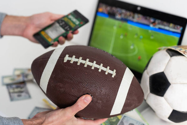 Live in-play betting app on smartphone display, a woman is betting at home and winning, POV shot. High quality photo