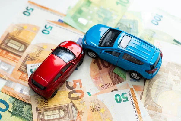 Small toy car and money. Loan and finance concepts. High quality photo
