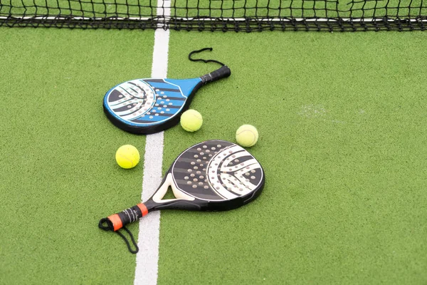 paddle sport on the paddle court, ball, rackets. High quality photo