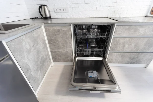 Dishwasher integrated in a modern kitchen. High quality photo