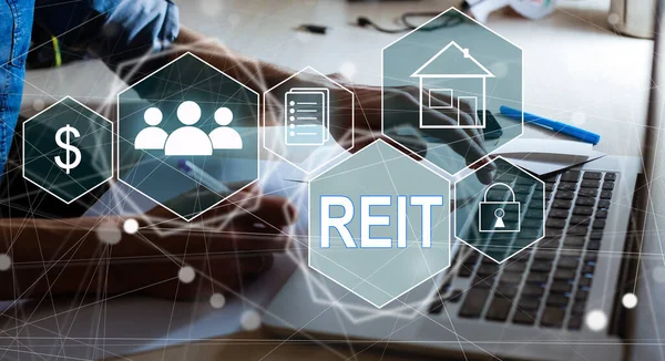 REIT, Real Estate Investment Trust concept, Person hand using smart phone with Real Estate Investment Trust icon on virtual screen