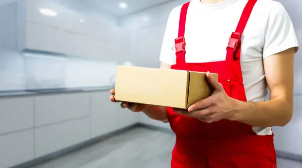 worker, delivery man with box.