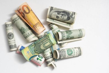 Money from different countries: dollars, euros.