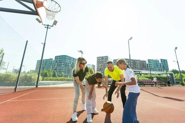 Time for family basketball. Family at basket playground. . High quality photo