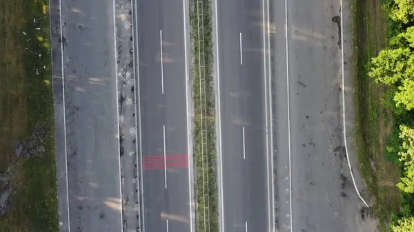 Aerial View Cargo Truck. Large Delivery Truck is Moving. Aerial Shot Of Lorry On Road In Beautiful Countryside. Aerial View of Semi-truck on Road In Spring Day