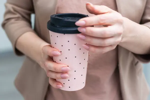 Womens hands with a cup of coffee. High quality photo