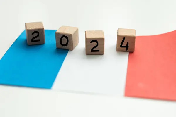 2024, France, France flag with date block, Concept, Important events for France in the new year, election, economy, social activities, central bank, France foreign policy. High quality photo
