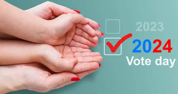 hand holding blue vote word. High quality photo