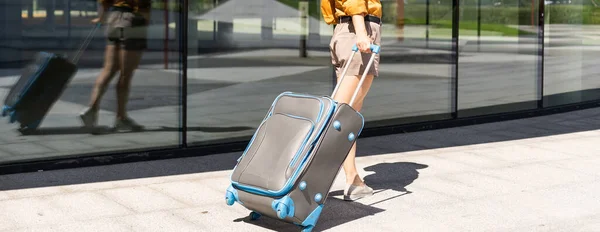 Woman with luggage. travels over the world.