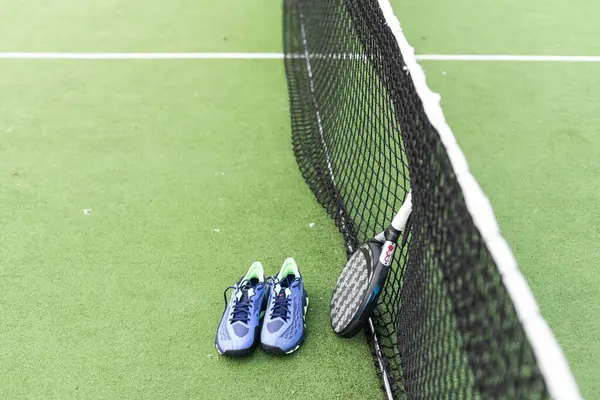 Padel tennis racket sport court and balls. Download a high quality photo with paddle for the design of a sports app or soical media advertisement. High quality photo