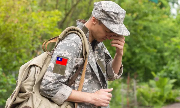 Flag of Taiwan on soldiers arm. Flag of Taiwan on military uniforms.