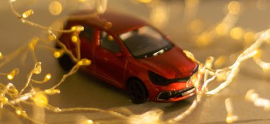 Miniature Car on colorful bokeh background. Holiday Merry Christmas concept