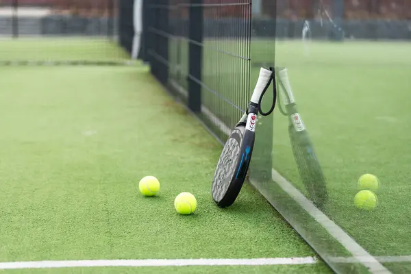 stock image White professional paddle tennis racket with natural lighting on blue background. Horizontal sport theme poster, greeting cards, headers, website and app. High quality photo