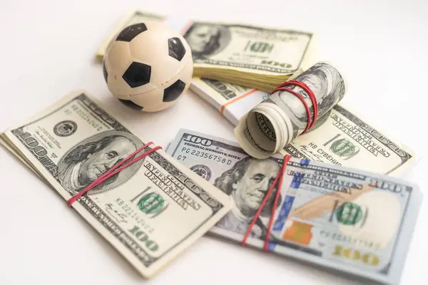 Money and soccer ball - sport and business background. High quality photo