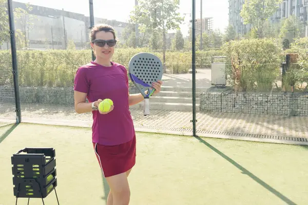 Stock image woman playing paddle tennis outdoors. High quality photo