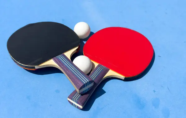 stock image Two rackets for ping-pong on a blue table. High quality photo