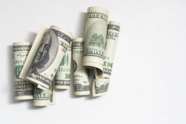 Belted roles of dollars closeup.