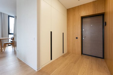 Stylish hallway with wooden furniture.