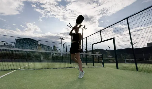 stock image Padel tennis player with racket. Girl athlete with paddle racket on court outdoors. Sport concept. High quality photo