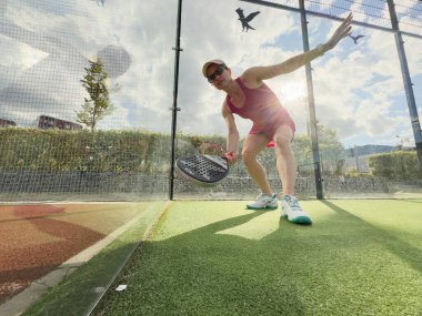 Kyiv, Ukraine, July 29, 2024. A woman plays a nox padel tennis racket. High quality photo clipart