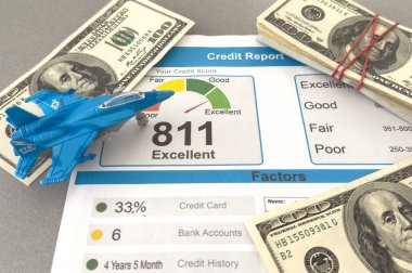 Credit score report document and toy plane on desk. High quality photo clipart