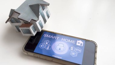Controlling home heating temperature with a smart home, close-up on phone. Concept of a smart home and mobile application for managing smart devices at home. High quality photo