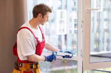 a repairman repairs, adjusts or installs metal-plastic windows in the apartment. glazing of balconies, loggias, verandas in house. production of double-glazed windows to individual sizes. clipart