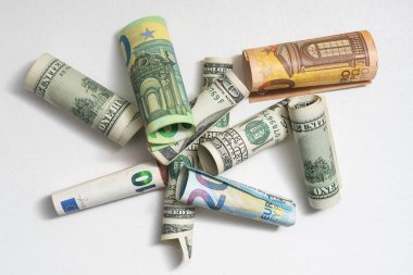 Money from different countries: dollars, euros.