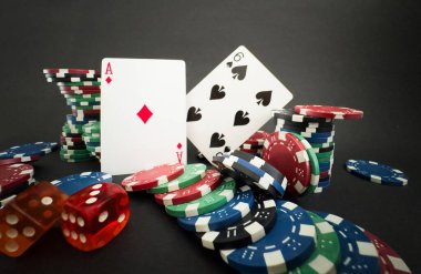 Playing cards and poker chips on table. High quality photo clipart