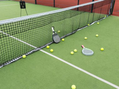 paddle tennis objects in court, racket and balls. High quality photo clipart