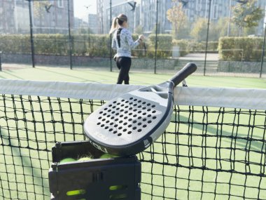 Kyiv, Ukraine, October 23, 2024. padel racket nox on a padel court with a ball. High quality photo clipart