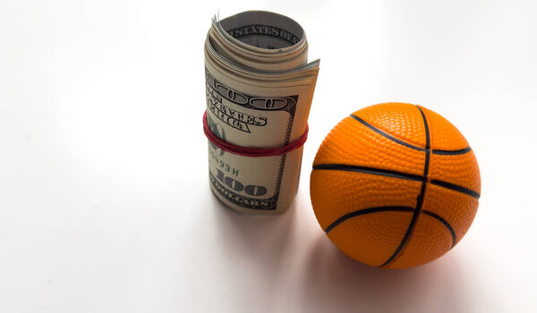 Small basketball ball dollars isolated on a white background. High quality photo
