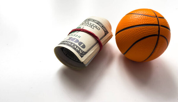 Small basketball ball dollars isolated on a white background. High quality photo