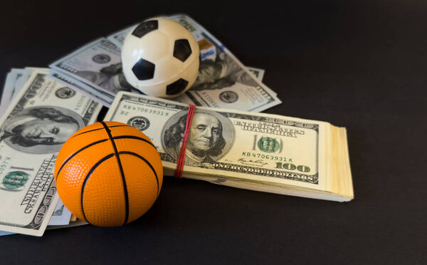 American dollars moving fast behind the soccer ball - Football player transfer . High quality photo
