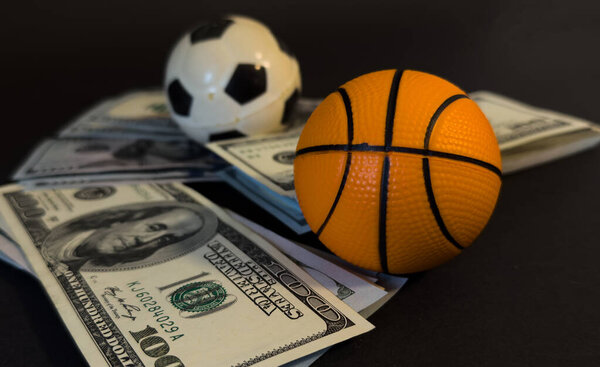 American dollars moving fast behind the soccer ball - Football player transfer . High quality photo