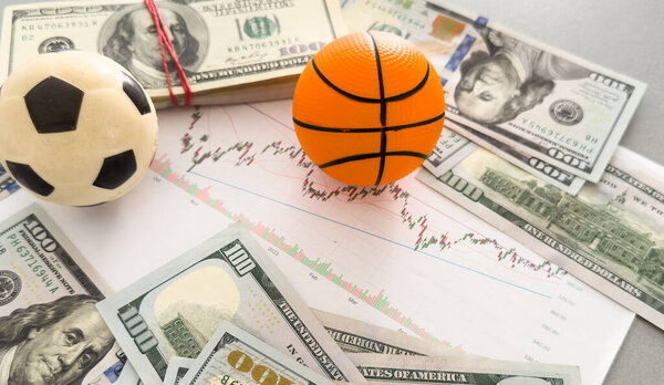 soccer ball over a lot of money. High quality photo