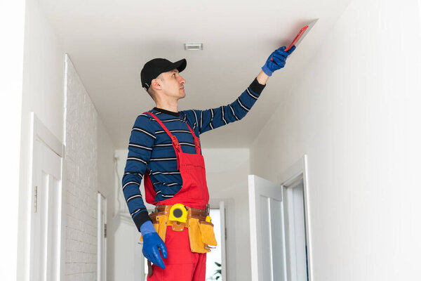 young construction worker. the man works on repairs.