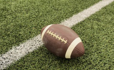 Yeşil çim arka planda Amerikan futbol topu. Yüksek kalite fotoğraf