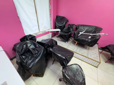 Furniture covered in tarp while painting a bedroom. High quality photo