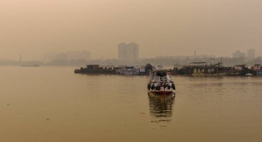 Kolkata, India, January 24, 2023: A Launch Roaming on The River Ganges in a winter Morning.
