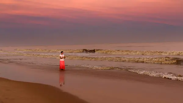 stock image An Unidentified Indian woman, Enjoying on the beach side, at the time of Sunset.