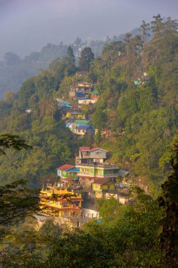 January 09,2024.Kurseong, West Bengal. India. Vertical view of Hillside Buildings. clipart