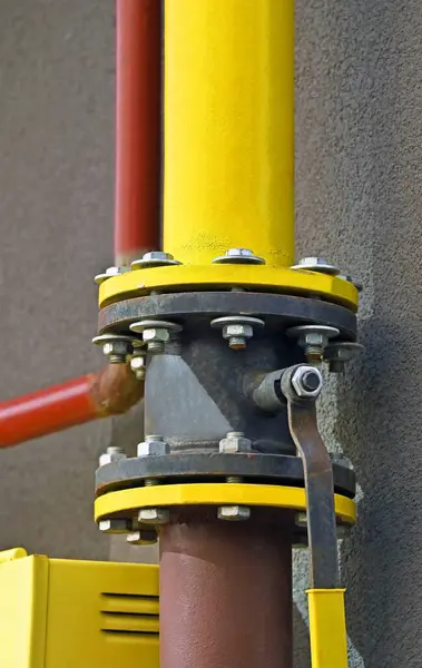 Shut-off gas valve on rusty iron pipeline