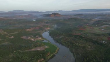 River run to the mountain in misty morning in Vietnam