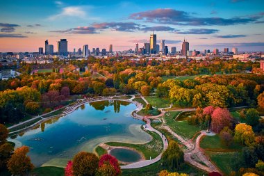 A beautiful panoramic aerial drone view of the sunset at Pola Mokotowskie in Warsaw, Poland - 