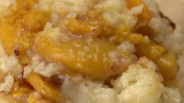 Top View Closeup Rotation Delicious Homemade Peach Cobbler Dessert Wooden — Stock Video