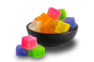 Cube shape crispy jelly. Closeup view pile of sweet colorful cube shape crispy jelly in black ceramic bowl isolated on white background with clipping path. clipart