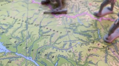 Little soldiers on the map of Ukraine. The concept of war in Ukraine. Smooth camera movement