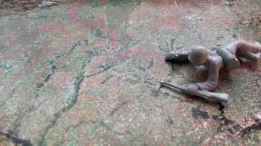 Little soldiers on the map of Ukraine. The concept of war in Ukraine. Smooth camera movement
